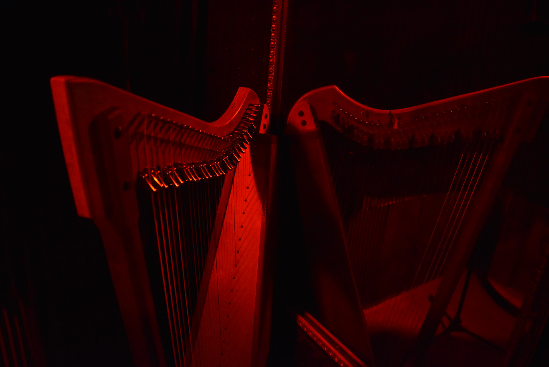 Stage set for the Life Story Poem Show with harp and spotlight